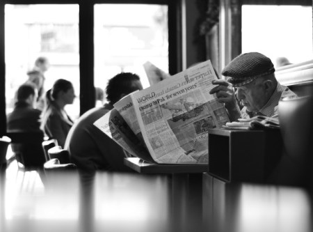 Old Man Reading a newspaper